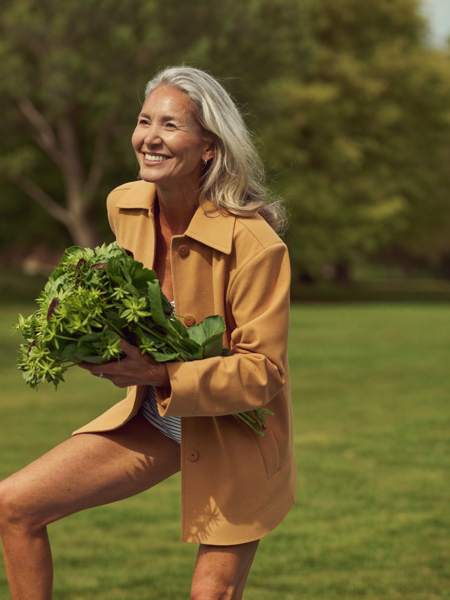 Longevity & Anti-Aging — a vibrant, active woman with silver hair in a sunny park