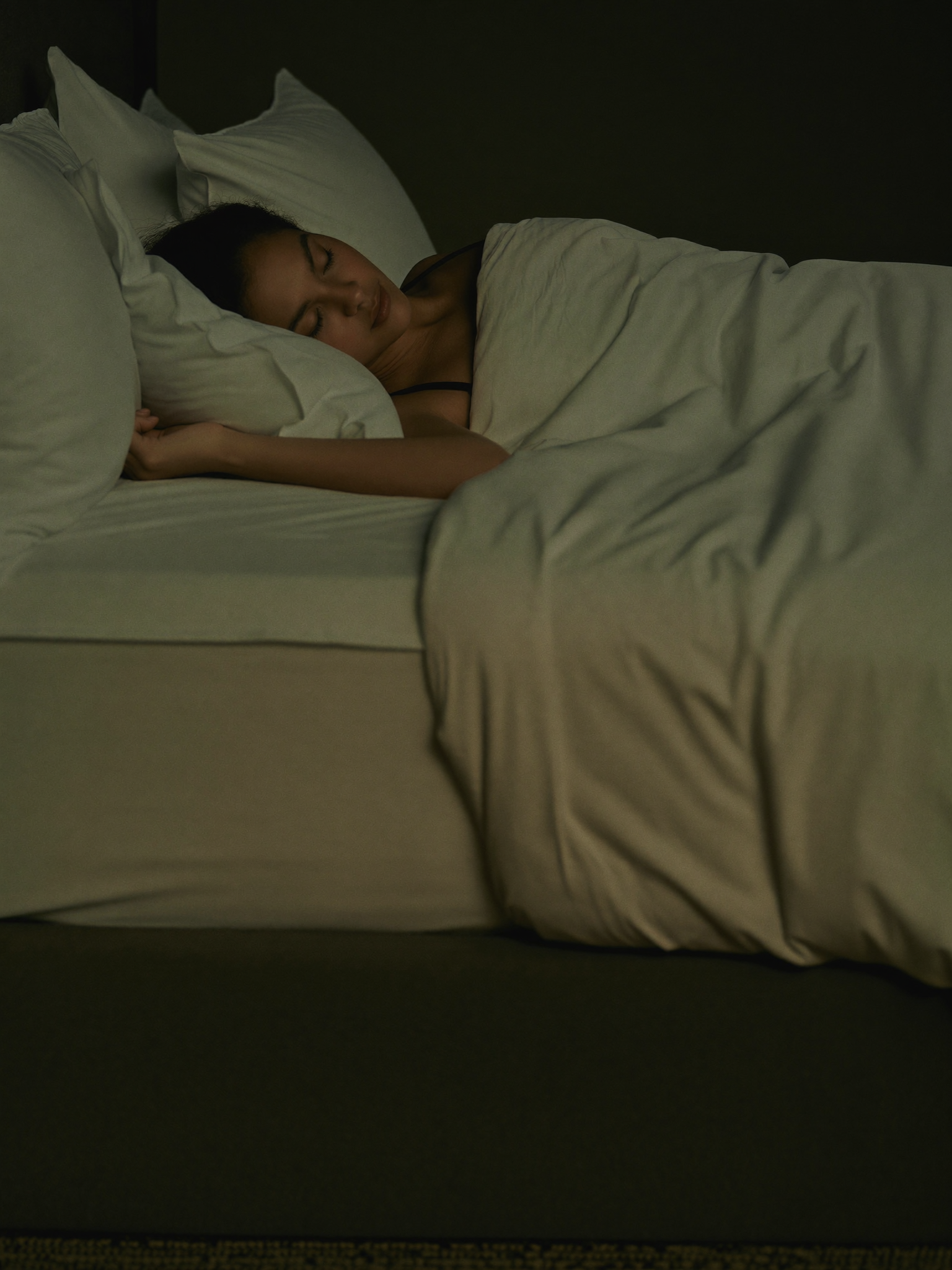 Sleep & Calm — a woman resting peacefully in soft evening light