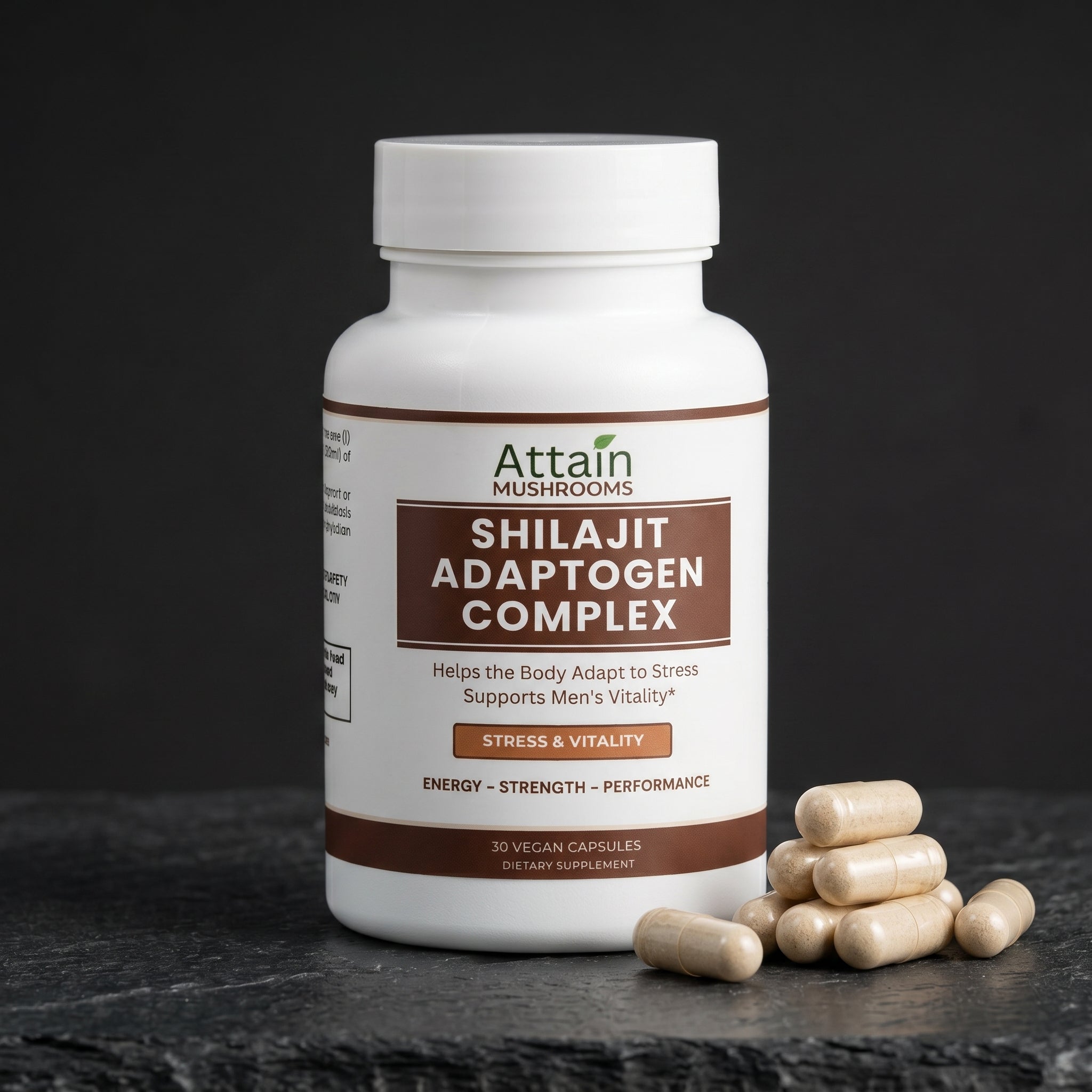 Attain Shilajit Adaptogen Complex vegan capsules beside the bottle | Attain Supplements